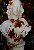 Bust of woman with tendril of Parthenocissus