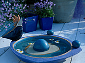 Birdbath, blue pots