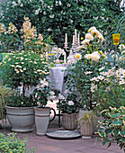 White terrace with daisy, dahlia, ornamental basket
