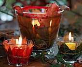 Wind lanterns wrapped in colorful autumn leaves