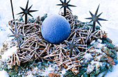 Wreath made of Nobilistanne, star made of willow twigs decorated with baubles and iron stars