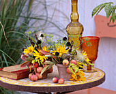Pots with Rudbeckia (coneflower fruits), dill, Paeonia (peony leaves)