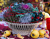 Metal basket: Brassica (ornamental cabbage), Calluna (heather), Gaultheria (mock berry), Calo