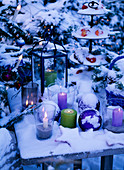 Wind lights, candles, lantern and etagere with Malus (apples)