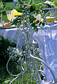 Chair back decorated with Convallaria (Lily of the Valley) and Wisteria
