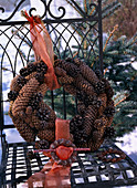 Wreath made of various cones in hoarfrost