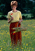 Woman in a flower meadow