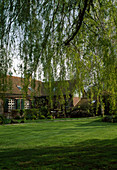 View over lawn to country house