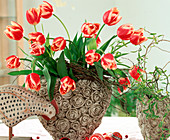 Bouquet of tulips in heart vase, decorative chicken