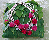 Pearl necklace with hearts and silk roses