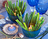 Lanterns placed in blue bowls