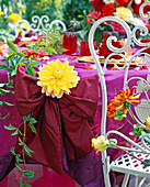 Festive dahlia table decoration on the terrace