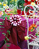 Festive dahlia table decoration on the terrace