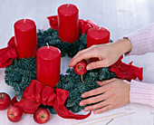 Nobilis wreath decorated in red