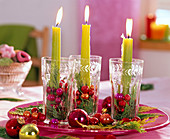 Green bar candles in glasses