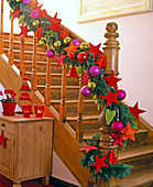 Garland of mixed green on stair rails