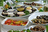 Plates with antipasti: pickled capsicum (paprika)