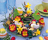 Colourful plate wreath as an Easter table decoration