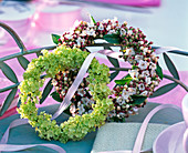 Wreaths of hydrangea (hydrangea) and viburnum tinus (laurel snowball)