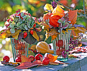 Bouquets of foliage, hydrangea, lanterns and rosehips
