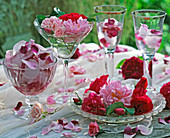 Pink (roses, red and pink), flowers and leaves in bowls, goblets