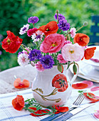 Bouquet from Papaver, Centaurea in milk jug