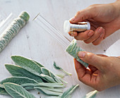 Wrapped glass tubes as vases on tablecloth (1/3)