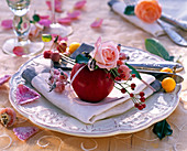 Rose rosehips and malus on white napkin