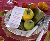 Cydonia (quince) on green napkin, menu card