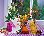 Bouquets of Hypericum (St. John's wort), Photinia (Medlar), Rosa (Roses)