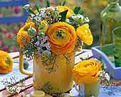 Ranunculus and Viburnum tinus bouquet