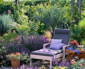 Braided couch between Lavandula (lavender) and palm trees