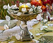 Candle decoration with Lunaria (silver leaf) and Vaccinium (blueberry branches)