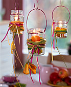 Screw lid glasses as hanging lanterns with spartina abdominal ligaments