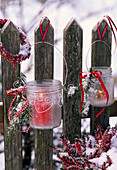 Lanterns with frost-optic spray and Picea (spruce) twigs