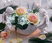 Roses and Christmas tree decorations in bowl with angels (4/4)