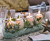 Unusual Advent wreath in elongated glass bowl