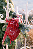 A bouquet of abies, dianthus, heart with message