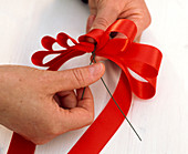 Tying a bow - door wreath (3/5)