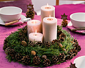 Advent wreath made of pine, twigs and cones