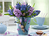Hyacinthus muscari in blue vase