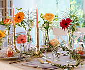 Table decoration with Gerbera, Rosa (roses), Lilium (lilies), Gypsophila