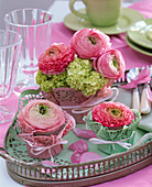 Ranunculus in a cake topping glass