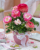 Ranunculus in planter with floral motifs, loop