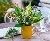 Bouquet of Convallaria majalis (Lily of the Valley) and grasses