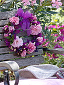 Fragrant flower wreath hanged on the back of the chair