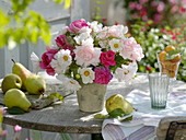 Bouquet of roses and ornamental baskets