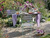 Set table on gravelled area in garden