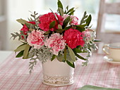 Small bouquet of Dianthus (carnations), Cineraria maritima (silver leaf)
