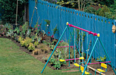 NEWLY PLANTED Garden, Blue PAINTED FENCE AND CHILDREN'S PLAY AREA. NICHOLS Garden, READING